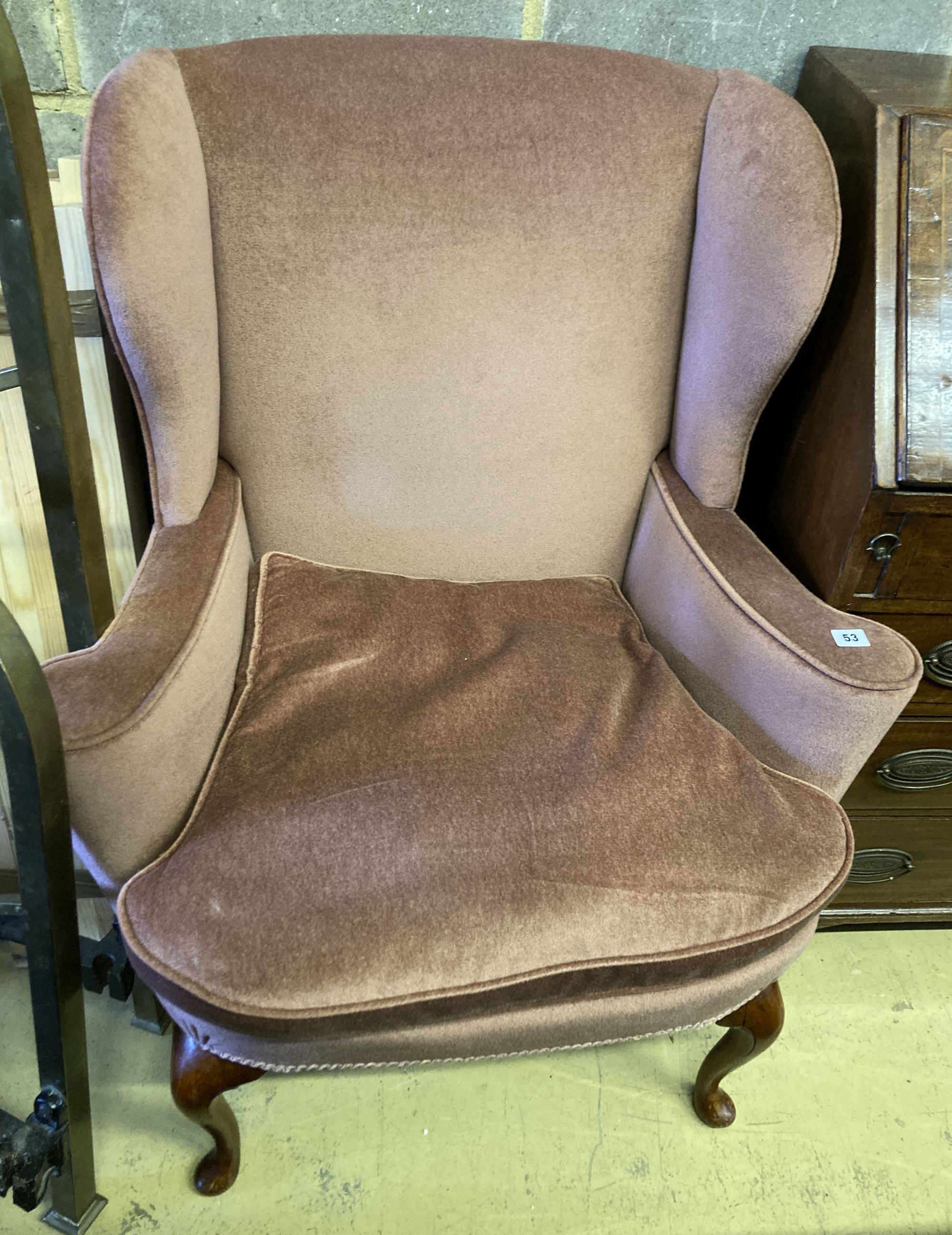 A Queen Anne style upholstered armchair, width 82cm, depth 60cm, height 100cm